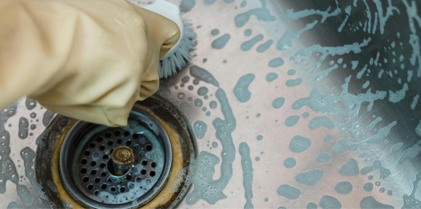 Cleaning a stainless steel kitchen sink drain in a Knoxville, TN home