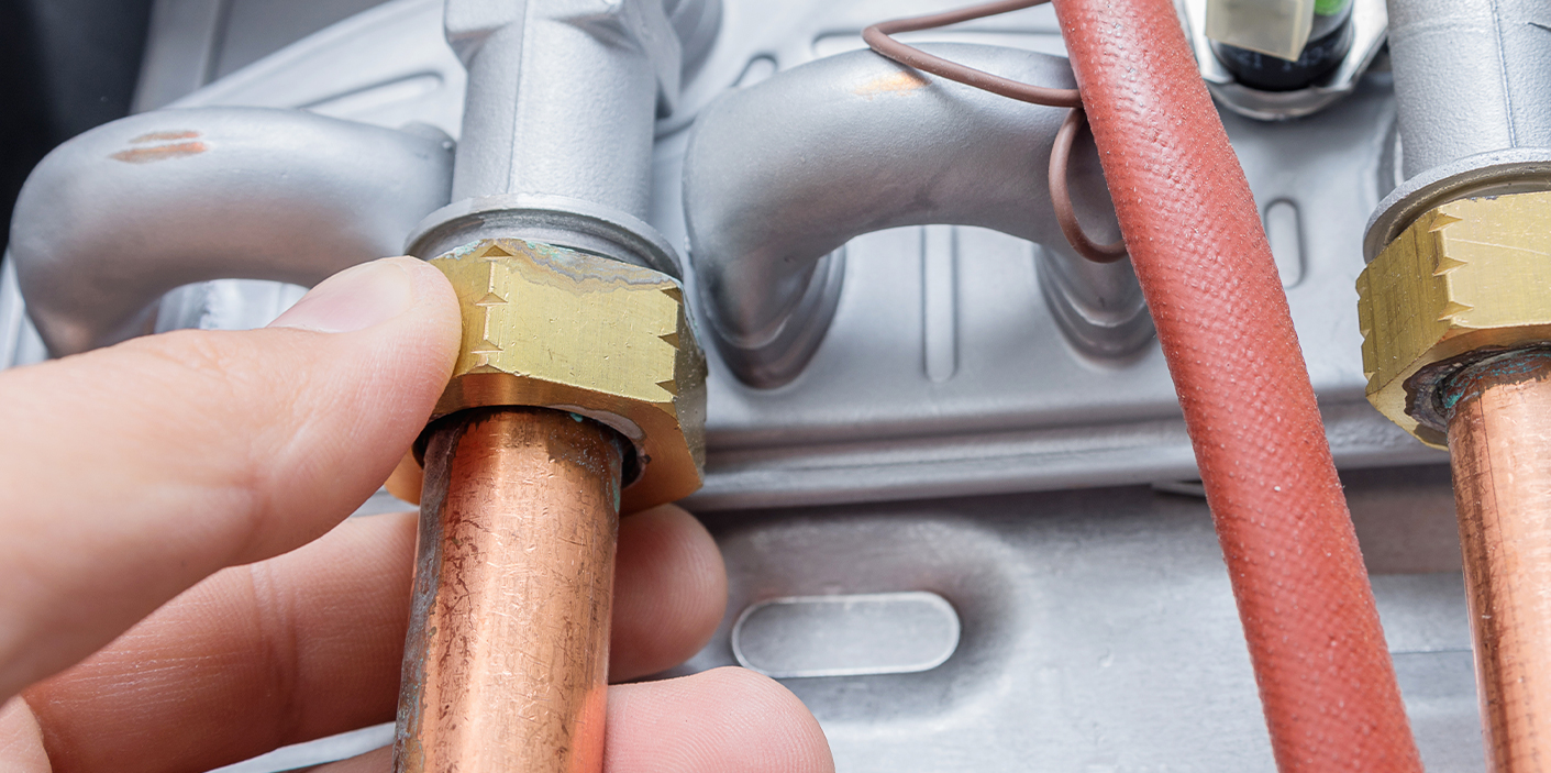 Technician inspecting water heater problems