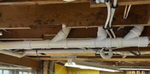 Improper PVC pipe layout showing signs the plumbing system is damaged