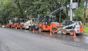 Commercial excavation equipment lined up for a main utility water line replacement project.