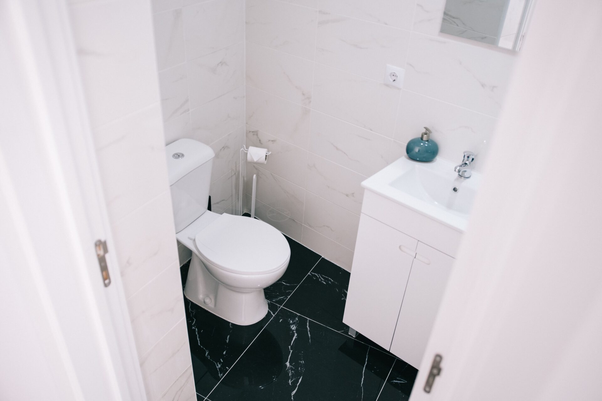 New modern toilet installed in a clean Knoxville bathroom after replacement